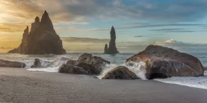 The iconic Reynisfjara beach on the South Coast of Iceland is known for its beautiful black sand stretching for miles of coastline.