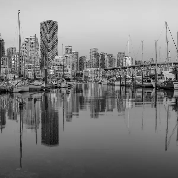 Sailboats dot the shoreline in Vancouver, British Columbia.