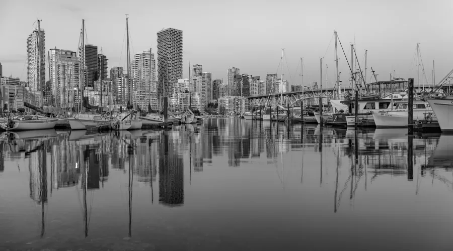 Sailboats dot the shoreline in Vancouver, British Columbia.
