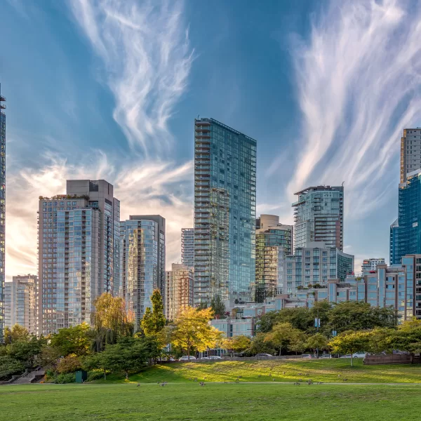 Clouds sweep the sky and the sun reflects off the buildings in Vancouver, British Columbia.