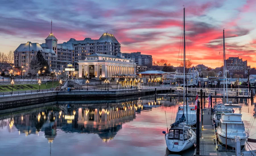 Victoria's harbour against a cotton candy sunset on Vancouver Island, BC.