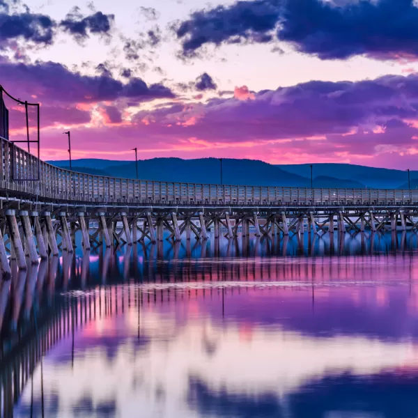 The pier in Salmon Arm stretches out into the Shuswap Lake with a breathtaking sky of rich hues of purple and pinks.